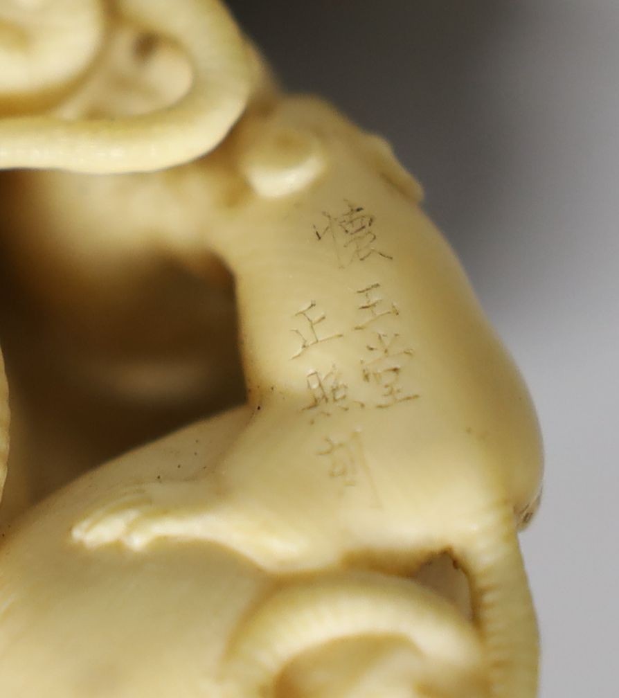 A fine Japanese carved ivory Okimono of a “mischief “ of rats, Meiji period, six character inscription, 5cms high.